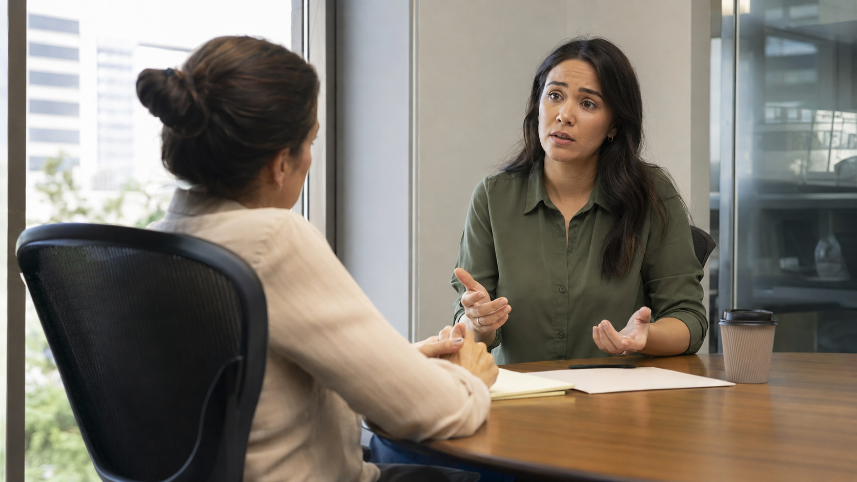 Employee speaking privately with compliance representative